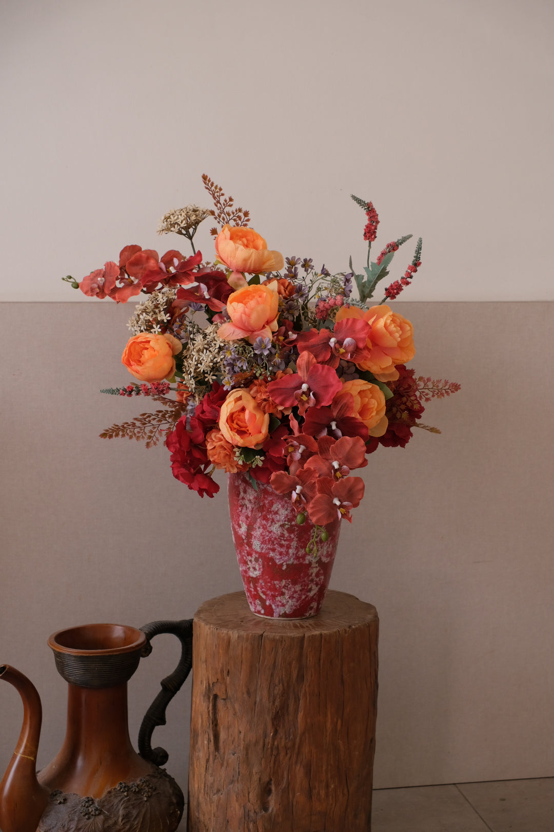 KIMONO artificial flower arrangement in red ceramic pot


