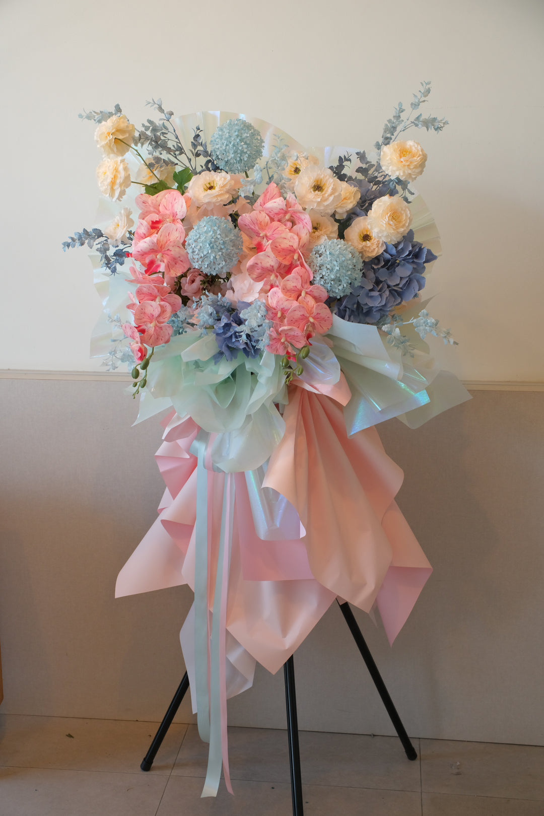 Minako Grand Opening Stand by Bamboo Green Florist Penang – pink, champagne, and blue artificial flower arrangement for grand openings.