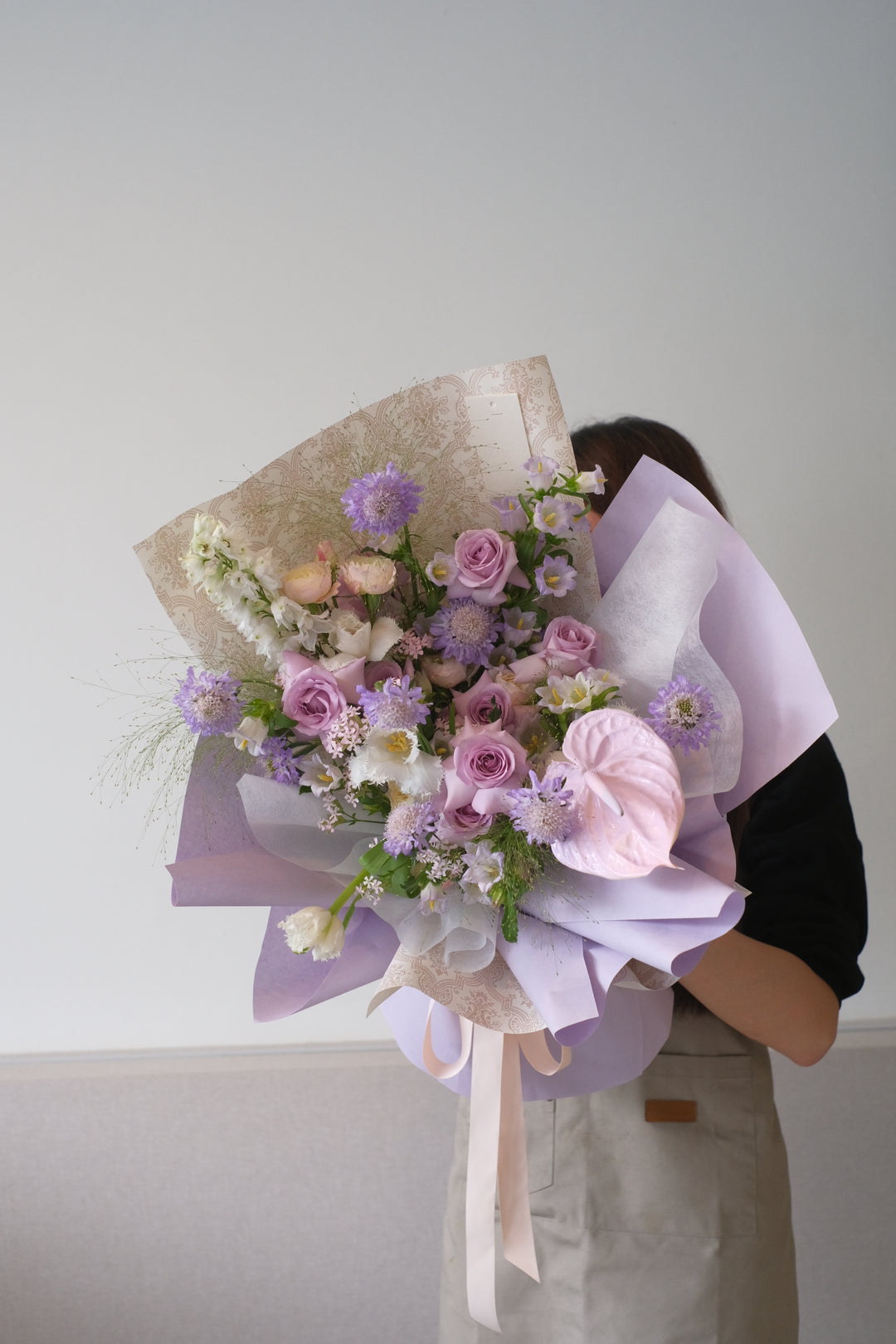 "Exquisite omakase arrangement of purple flowers for delivery in Penang Island."