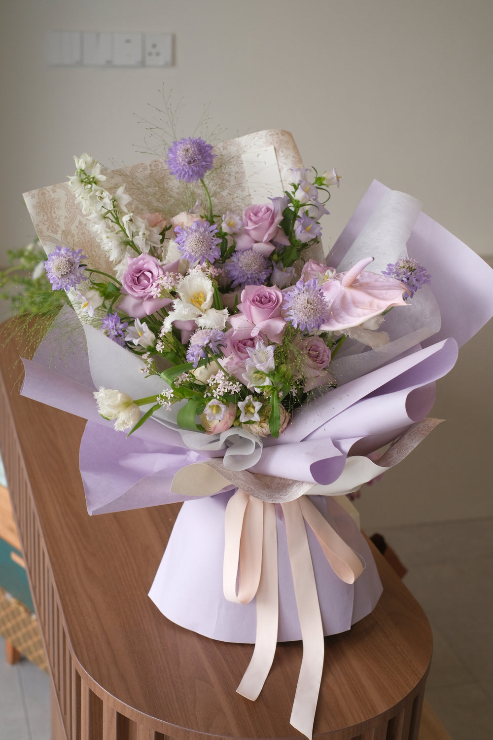 "Exquisite omakase arrangement of purple flowers for delivery in Penang Island."