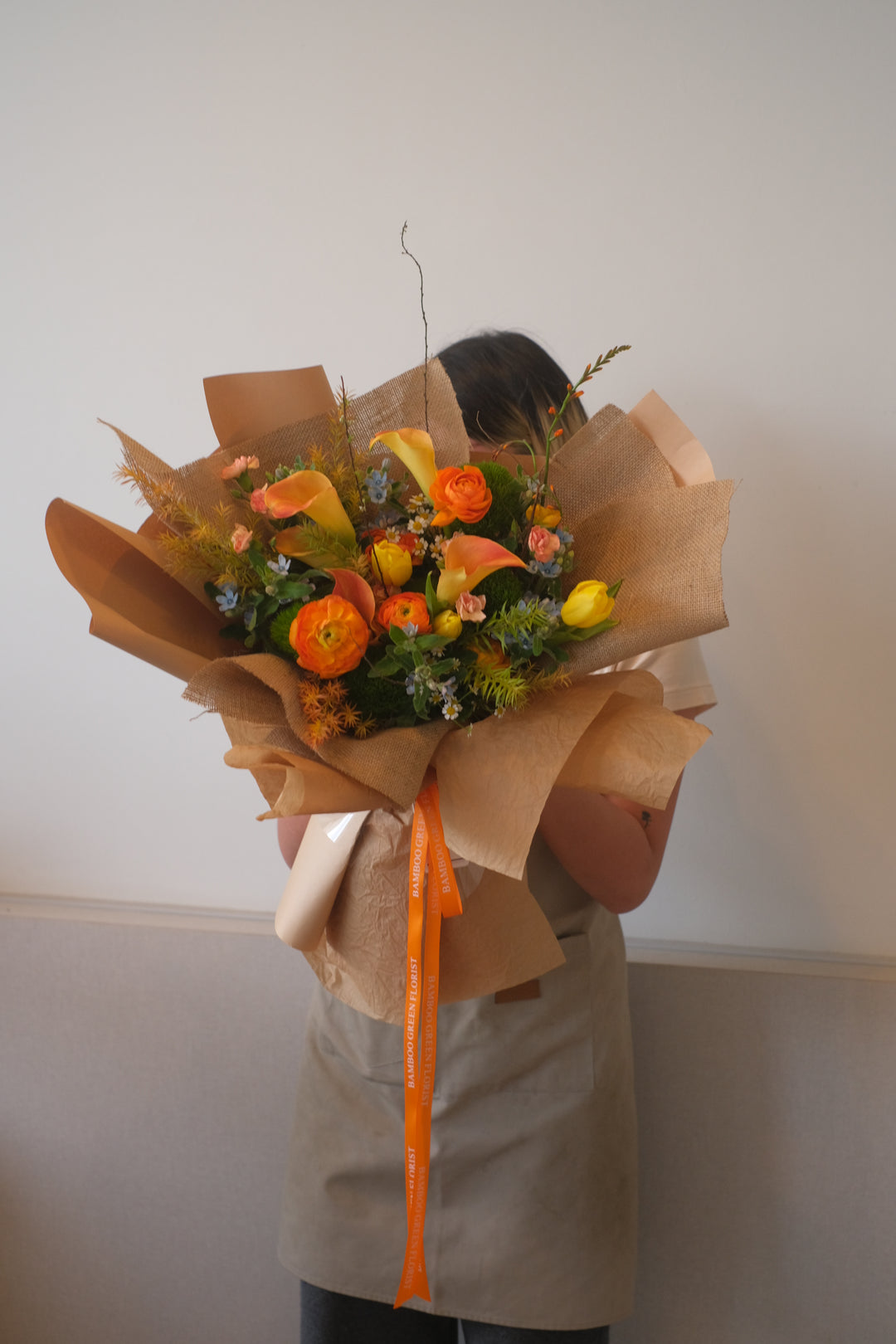 A unique, handcrafted floral arrangement featuring elegant eustoma, chamomile, and other fresh blooms. A perfect surprise for Valentine's Day. Order online from Bamboo Green Florist, your trusted Penang florist.