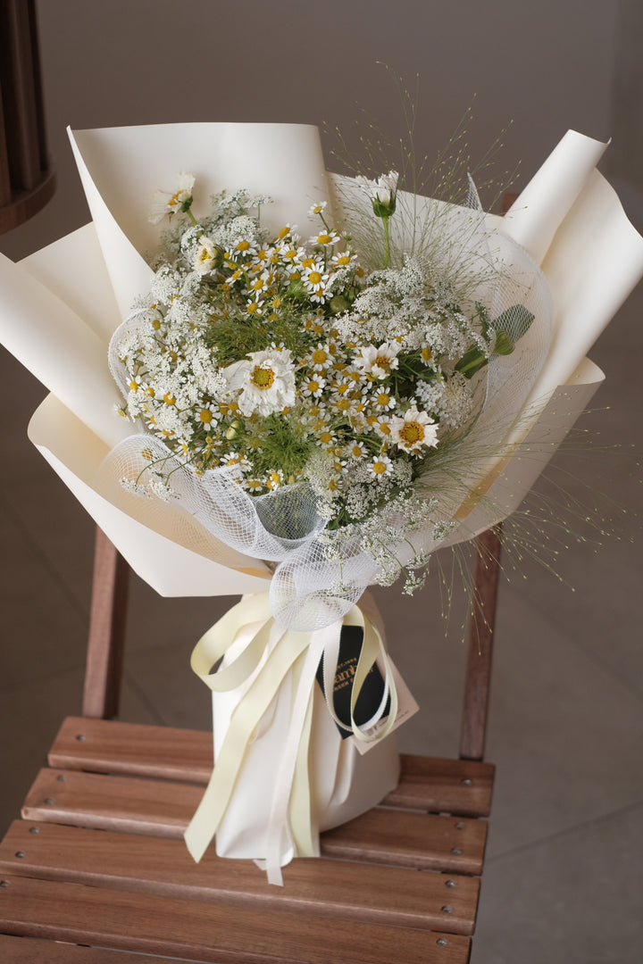 Omakase Dainty – a charming Valentine's Day bouquet with three roses, eustoma, and chamomile, handcrafted for a delicate and elegant touch. Order online from Bamboo Green Florist, your trusted Penang florist.