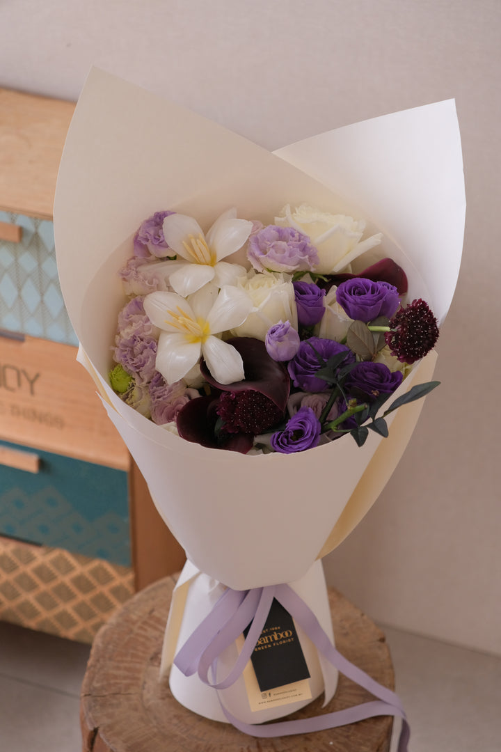 Elegant omakase-style bouquet in midnight lavender tones from Bamboo Green Florist Penang, handcrafted with seasonal blooms.