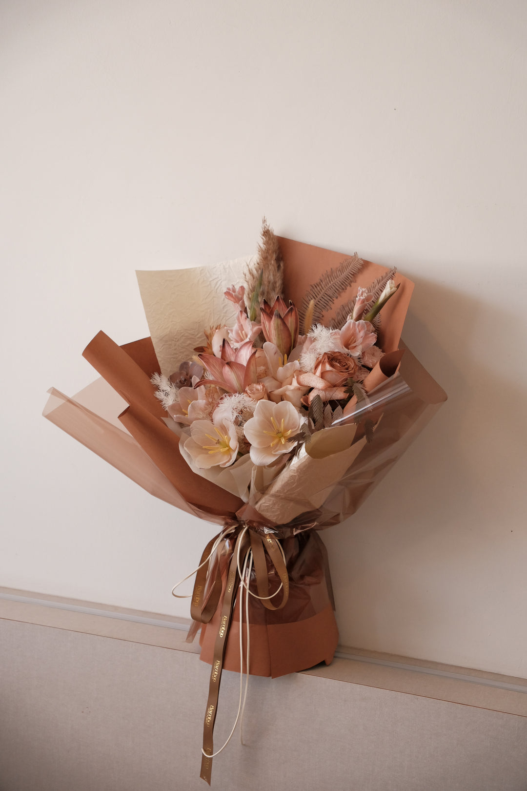 “Omakase earthy muse bouquet in terracotta and beige tones with soft neutral blooms and organic textures | Bamboo Green Florist Penang | Earth tone floral design Malaysia.”