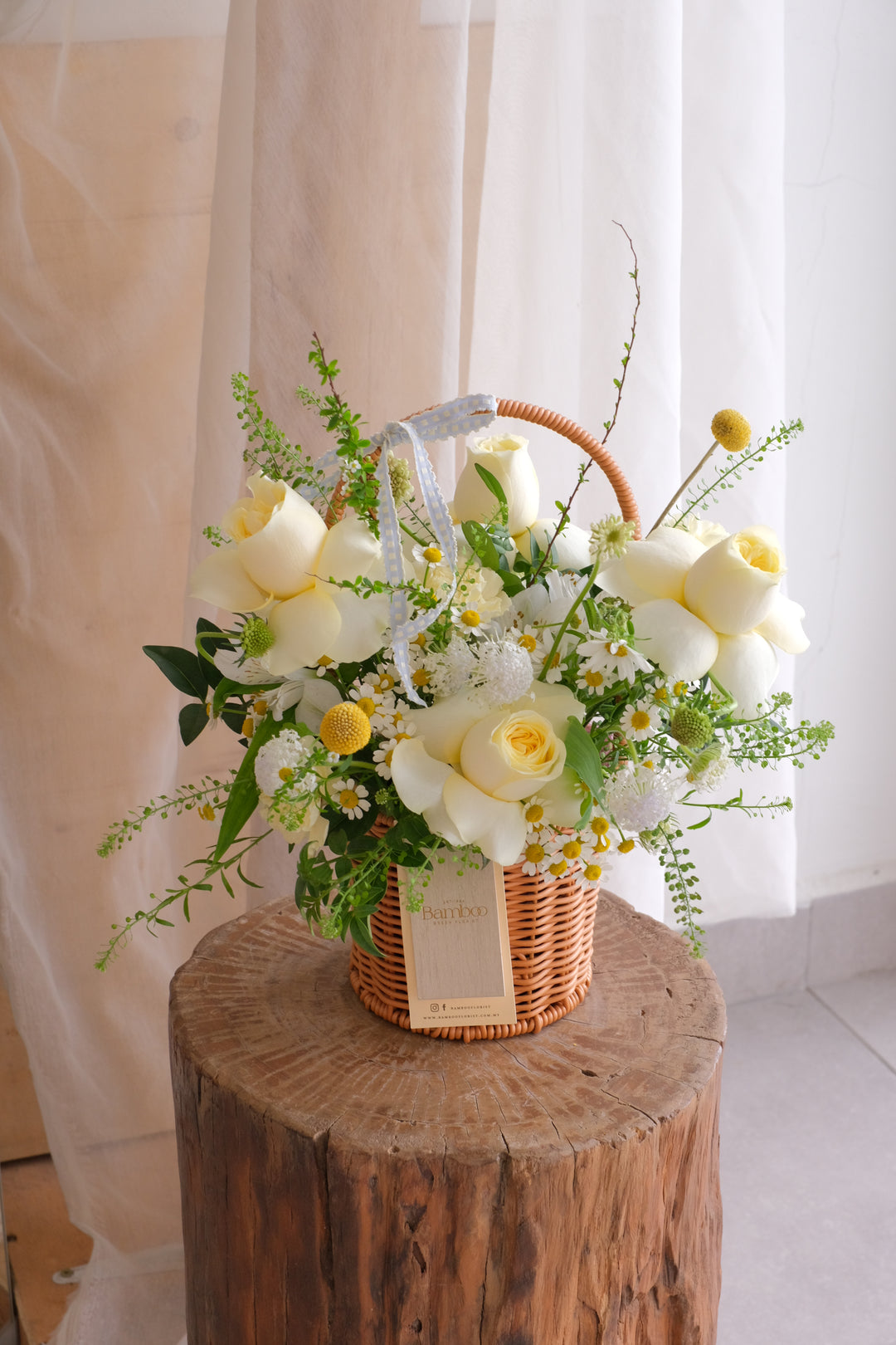 A petite basket of yellow buttercup roses and mini blooms. Bright, cheerful, and perfect for daily gifting, thank-yous, and cosy home styling. Handcrafted in Penang.