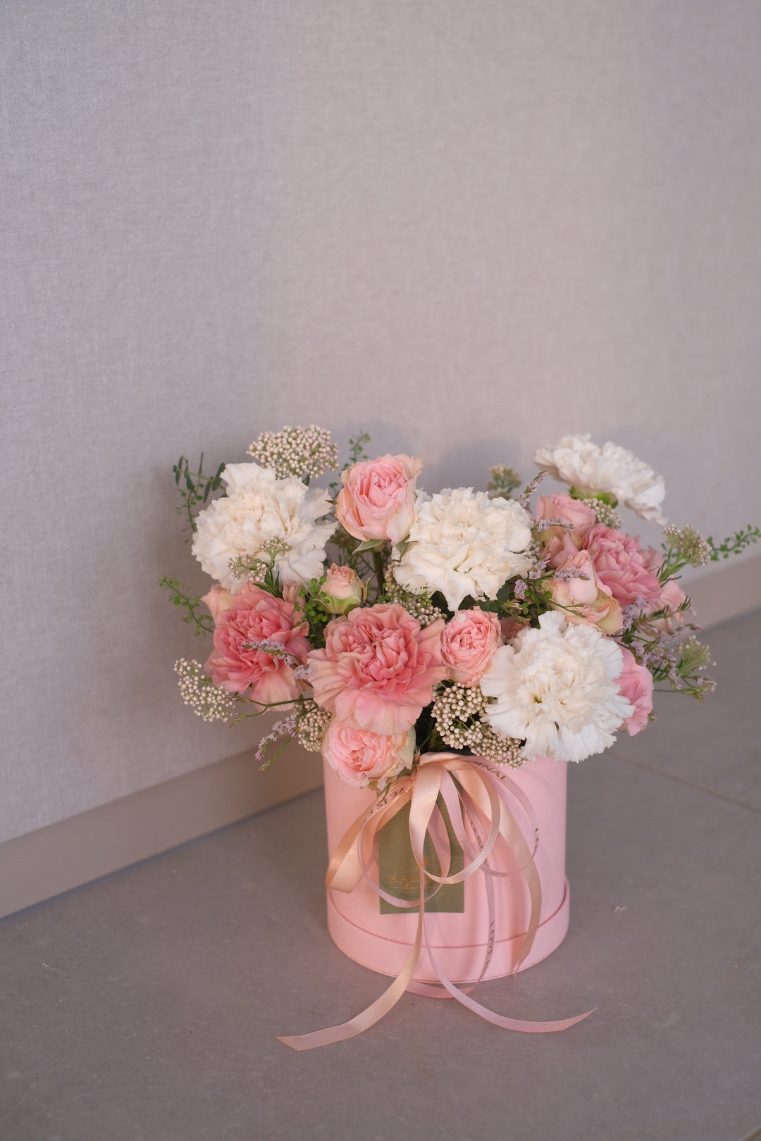 Mom, you're souper - thanks for always filling our lives with warmth and nourishment."  A stunning bloom box with mixed carnations, roses, and seasonal fillers, packed with all good essentials like how she nourished us as ever.Mom, you're souper - thanks for always filling our lives with warmth and nourishment."  A stunning bloom box with mixed carnations, roses, and seasonal fillers, packed with all good essentials like how she nourished us as ever.