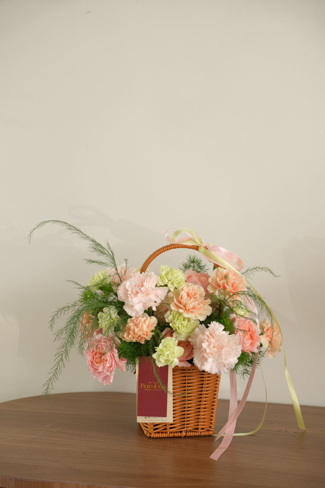 Cottage-core style small wicker flower basket, soft pastel floral aesthetic for Mother's Day gift ideas.