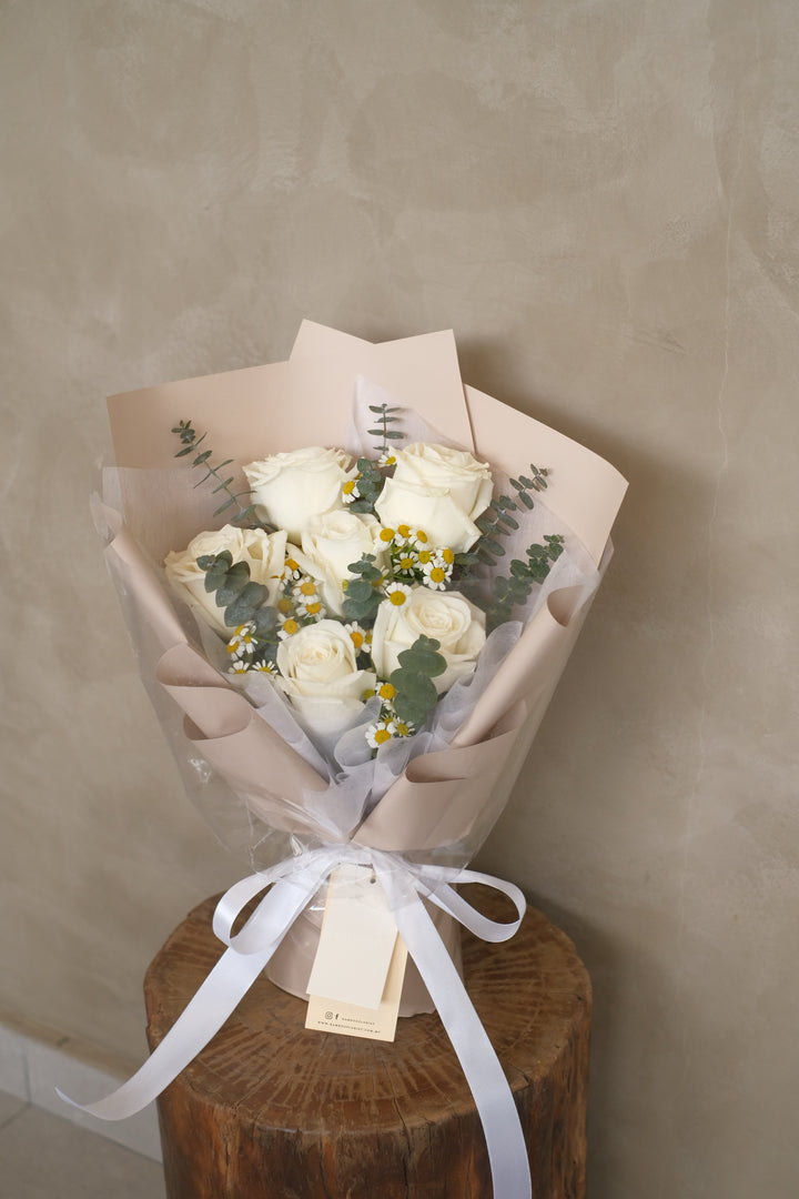 bouquet of white roses and chamomiile