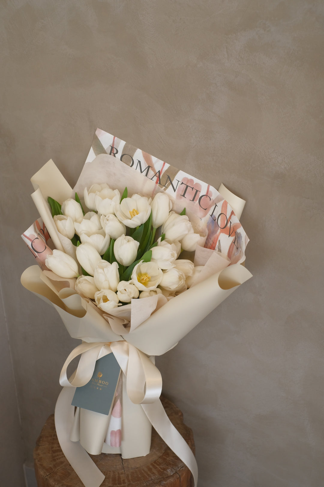 Elegant bouquet of white tulips arranged en masse, symbolizing purity and grace.