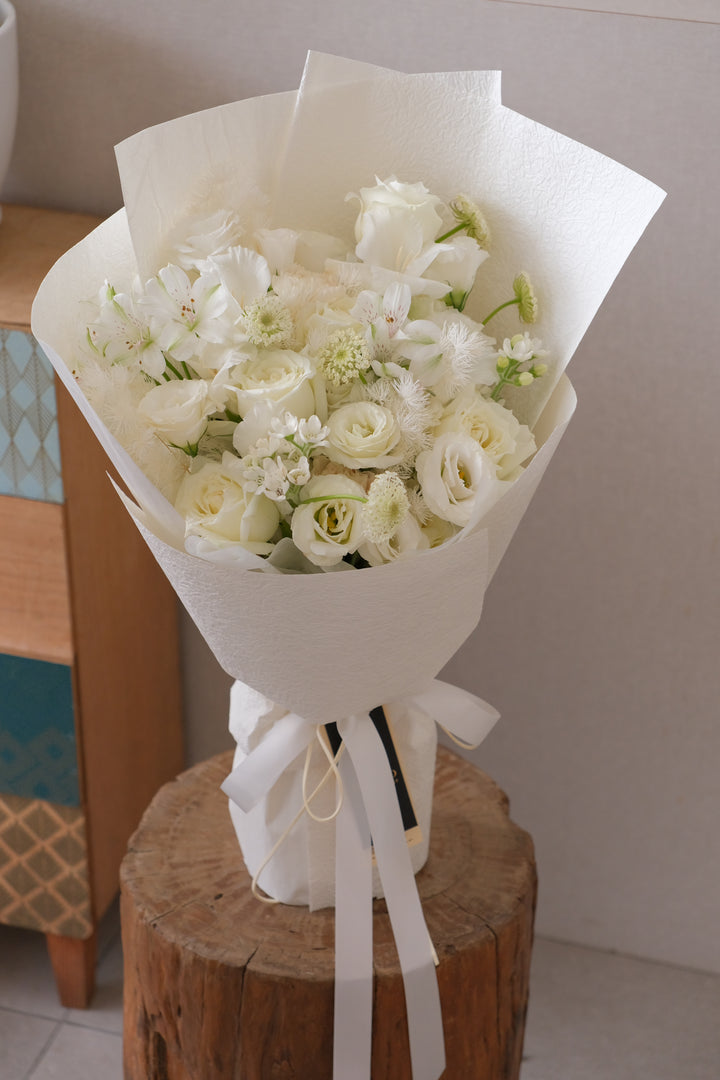Luxury all-white bouquet with roses and tulips by Bamboo Green Florist Penang — elegant wedding and anniversary flowers.