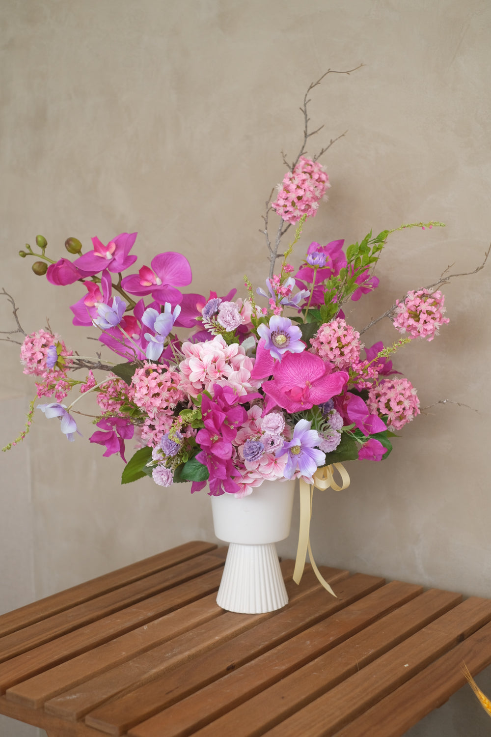 Set the perfect mood with festive tabletop artificial flowers for your business venture. Order online from Bamboo Green Florist for same-day delivery in Penang!