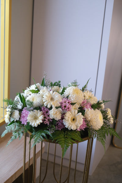 Funeral flowers spray in light and harmony colours with designer choice of flowers. 