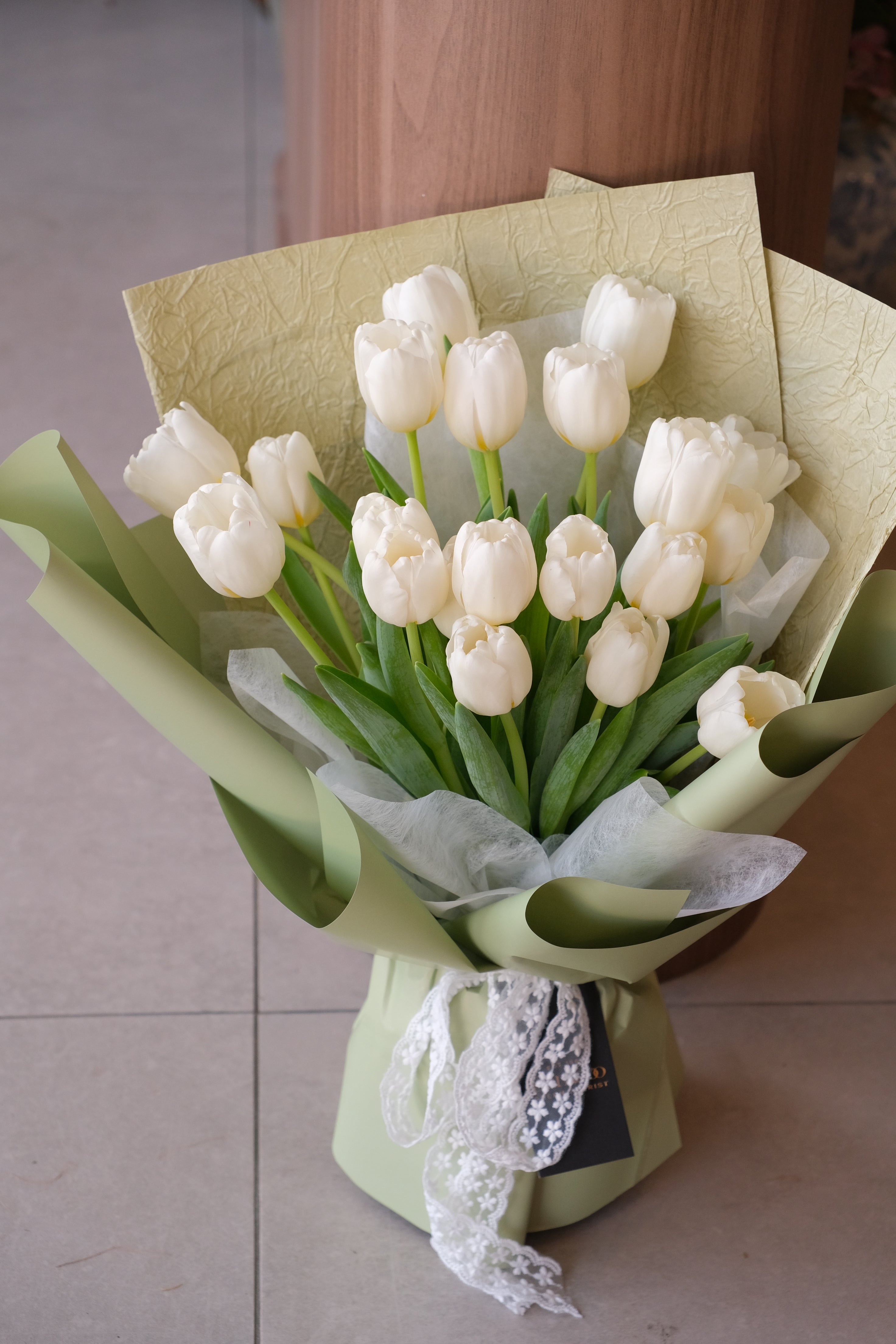 white tulips in green wrap for penang delivery