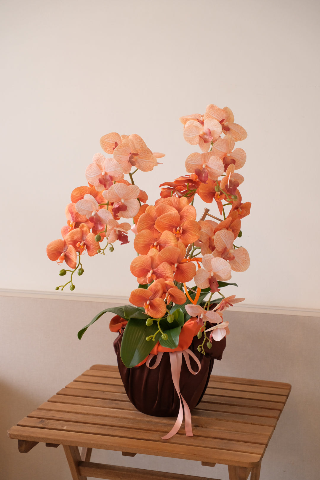 Artificial two-tone orchid arrangement with gold ladder accent