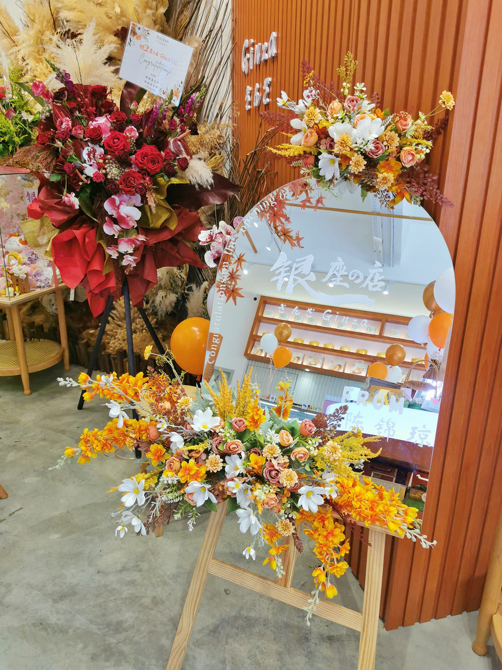 Image of a decorative mirror adorned with artificial flowers, ideal for social media or gram-worthy moments, flower delivery in penang