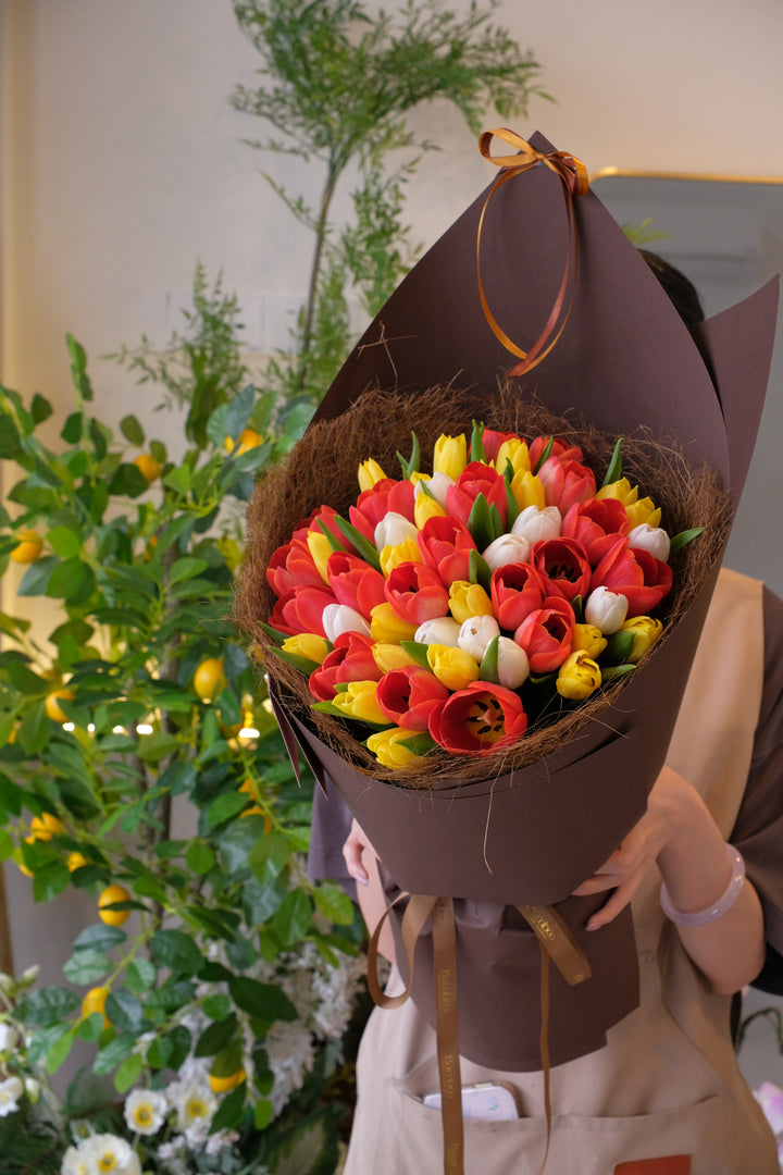 50 stalks assorted fresh tulips Mother's Day orchid arrangement . The ultimate gift from Bamboo Green Florist, best florist in Penang.