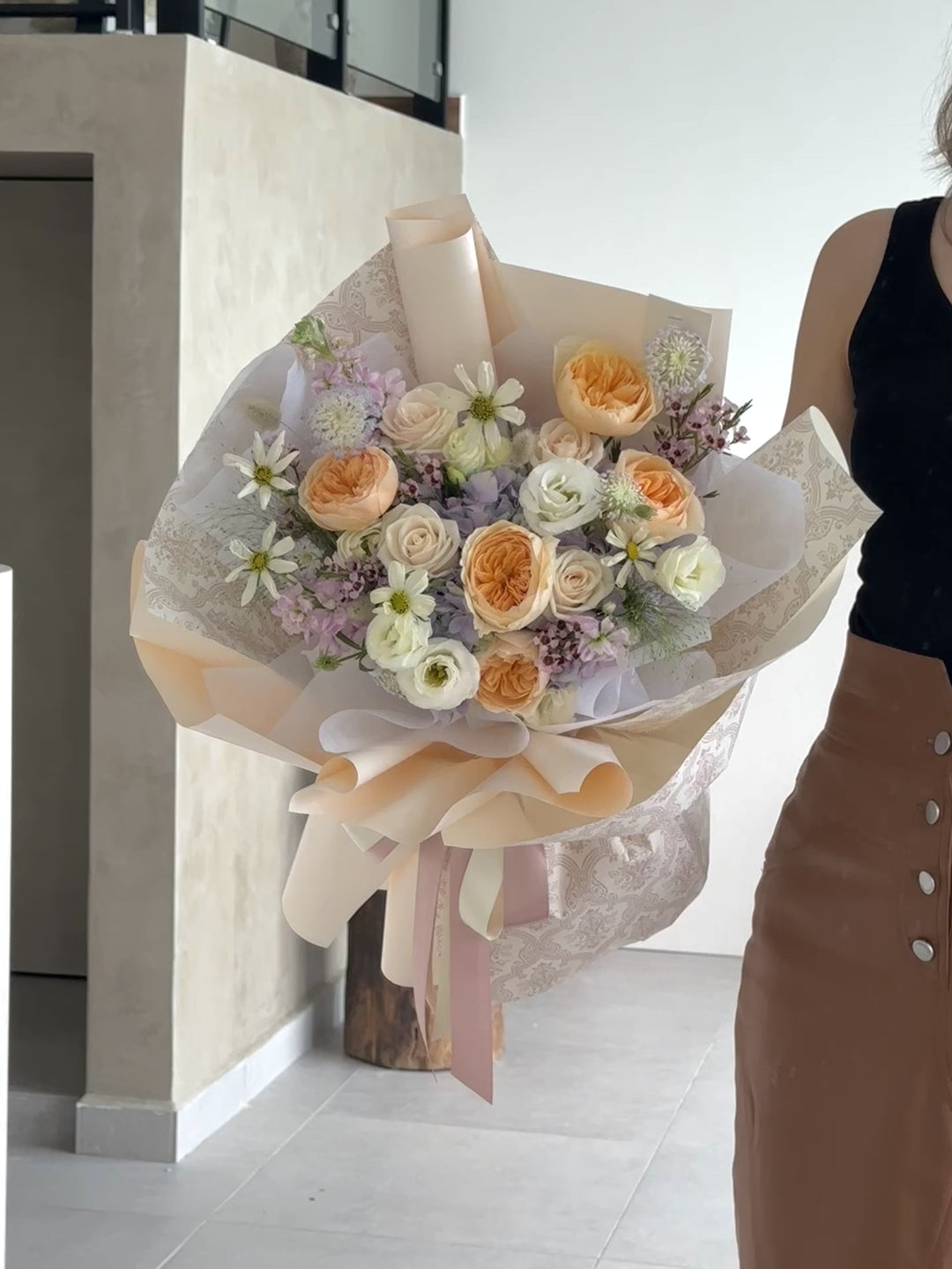 A bouquet of luxurious, high-quality Juliet roses with vibrant and luscious petals in various shades of pink and peach