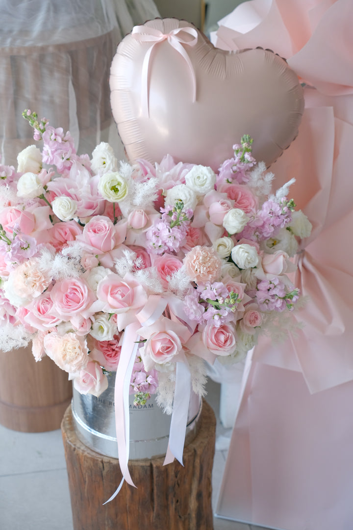 Venetian luxe romance flower box overflowing with pink and cream garden roses, lisianthus and stock in a keepsake box.
