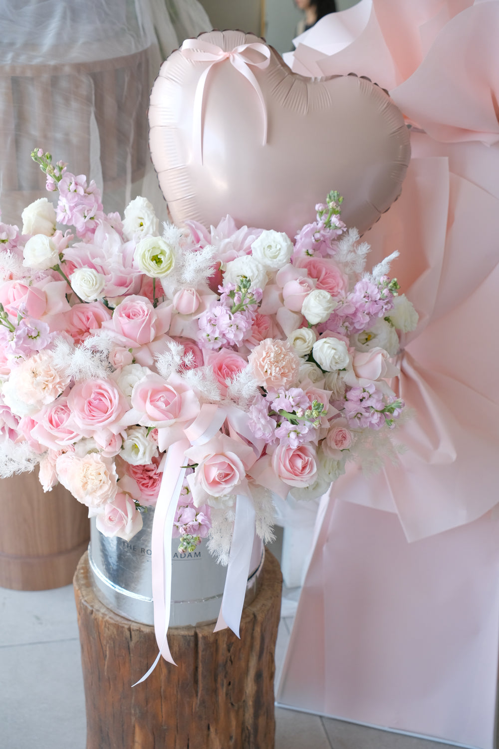 Close-up of the pink and cream garden roses and soft blooms in the Venetian romance arrangement.
