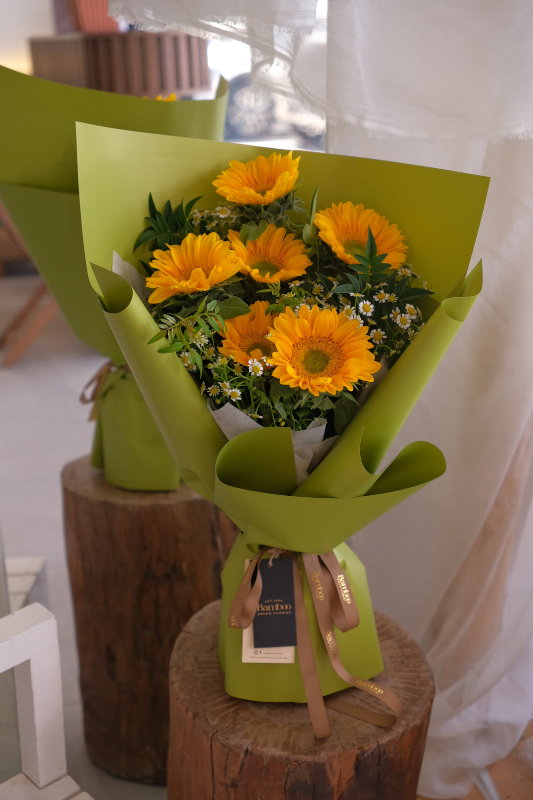 Green Heart Sunflowers and Chamomiles bouquet in Apple-green sculpted wrap — Bamboo Green Florist Penang
