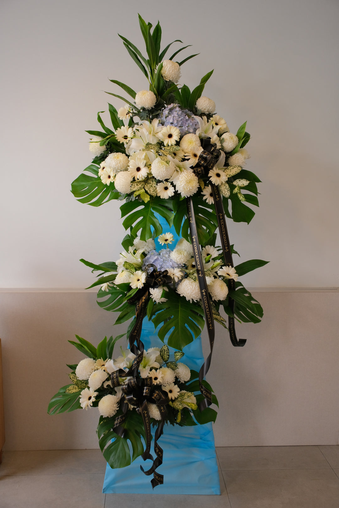 Funeral flower stand delivery, Condolence flowers, 3-tier sympathy spray.