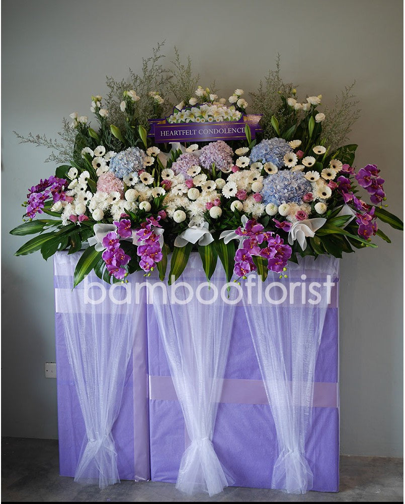 This lovely condolences floral testament to the circle of life and love evokes beautiful memories even during the most difficult times. For same day condolences flowers delivery in Penang. 