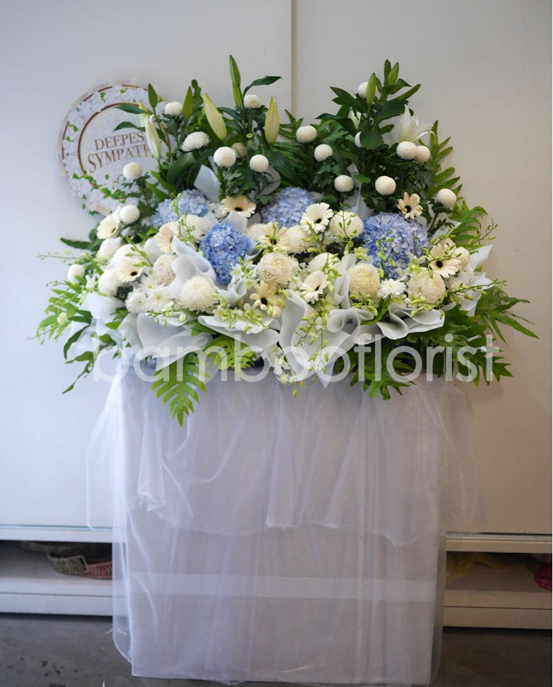 This lovely floral testament to the circle of life and love evokes beautiful memories even during the most difficult times. For same day condolences flowers delivery in Penang.
