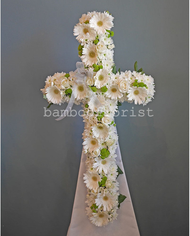 To help offer your condolences, and remember the joy they brought in life, we've put together daisies, white roses green button poms, white pompoms, with eucalyptus leaves. Send your condolences, or remember their life with one last celebration.  For same day condolences flowers delivery in Bukit Mertajam