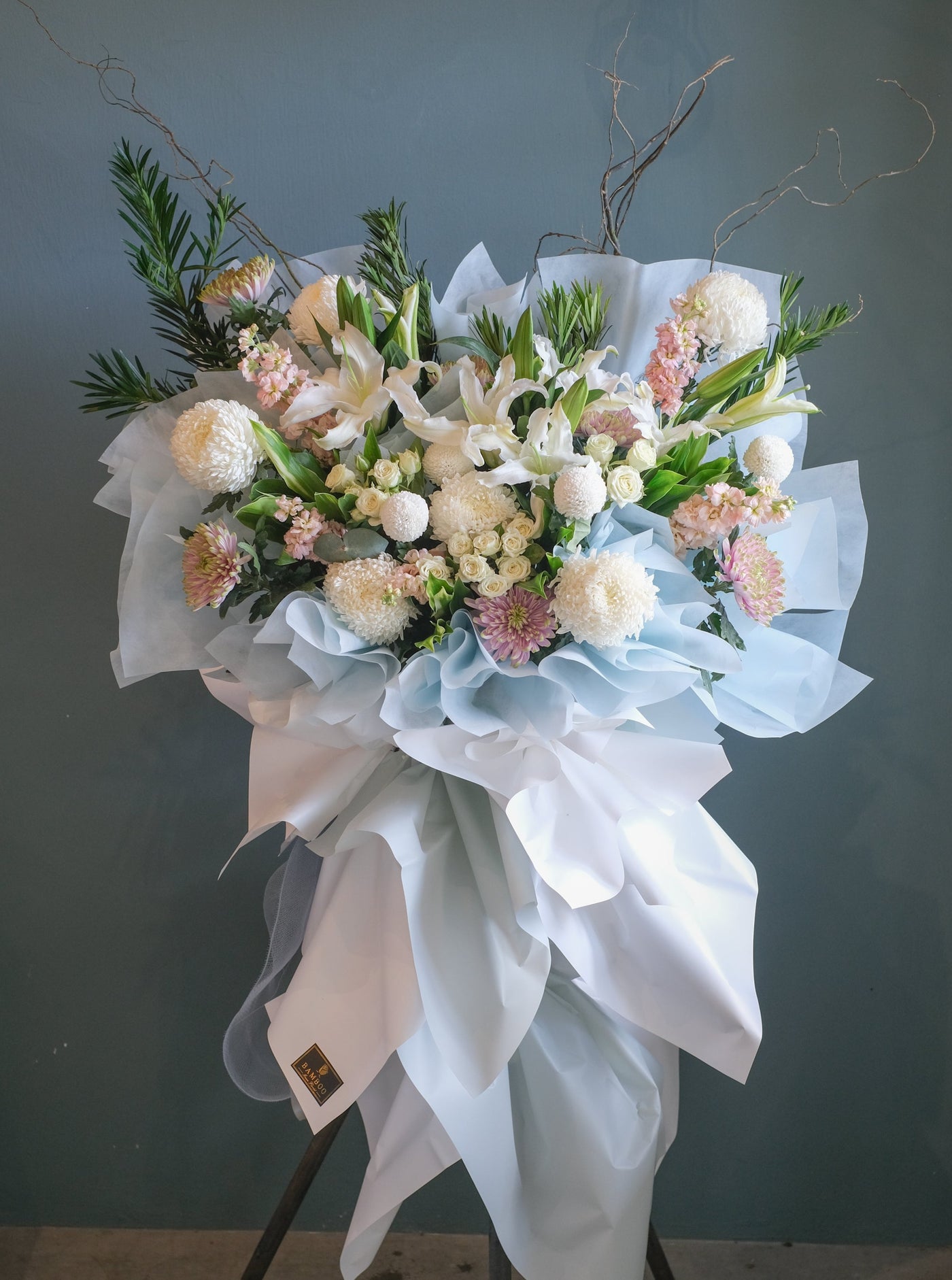 The loss of a loved one can be hard to accept. To help offer your condolences, and remember the joy they brought in life, we've put together lilies,  roses, chrysanthemums, lotus thomas, and lush ferns to honor your loved one. Send your condolences, or remember their life with one last celebration. For same day condolences flowers delivery in Penang. 