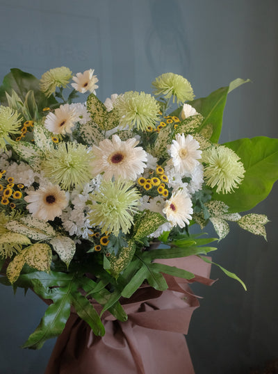 The loss of a loved one can be hard to accept. To help offer your condolences, and remember the joy they brought in life, we've put together lilies, gerberas, chrysanthemums, dancing lady, anthuriums, pompoms and lush ferns to honor your loved one. Send your condolences, or remember their life with one last Celebration. For same day condolences flowers delivery in Penang.  
