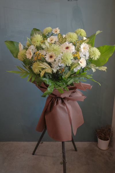 The loss of a loved one can be hard to accept. To help offer your condolences, and remember the joy they brought in life, we've put together lilies, gerberas, chrysanthemums, dancing lady, anthuriums, pompoms and lush ferns to honor your loved one. Send your condolences, or remember their life with one last Celebration. For same day condolences flowers delivery in Penang.  