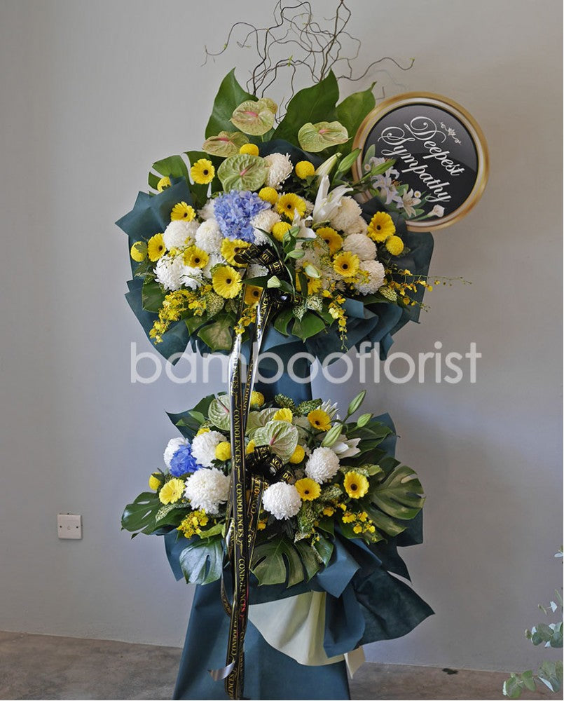 Let the family members know you care and understand with a simple gesture with the funeral stand comprises with matthiola, daisies, white chrysanthemums and pompoms.  For same day condolences flowers delivery in Penang.  