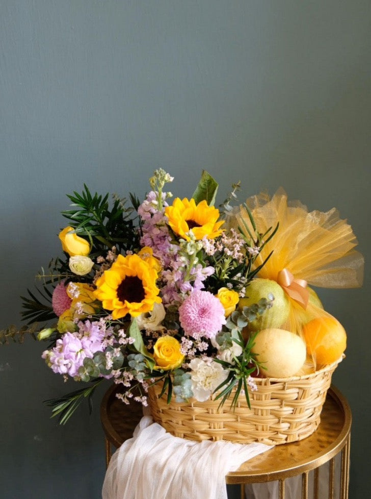 Featuring an array of juicy fruits, such as pears, apples and oranges, this generous gift is certain to get you into their good books. Accented by a beautiful flower arrangement of sunflowers, roses, ping pongs & fillers. Same day fruit basket delivery in Penang and Butterworth.