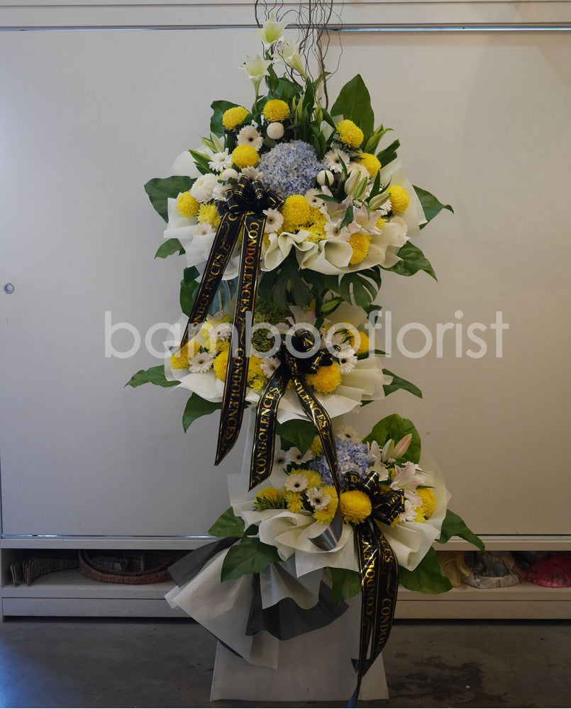 An expression of love, empathy and remembrance, this is a lovely funeral flower choice for those who lived life to the full. Designed to bring a touch of light to the very darkest of days, it includes an uplifting arrangement of yellow gerberas, yellow ping pongs, pompoms in decorative greens. For same day condolences flowers delivery in Penang.