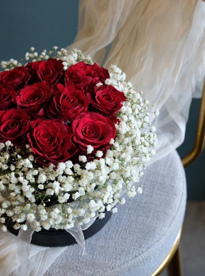 10 stalks of red roses elegantly arranged in a bloom box, symbolizing timeless love and passion. Perfect for any romantic occasion. Same-day delivery in Penang.