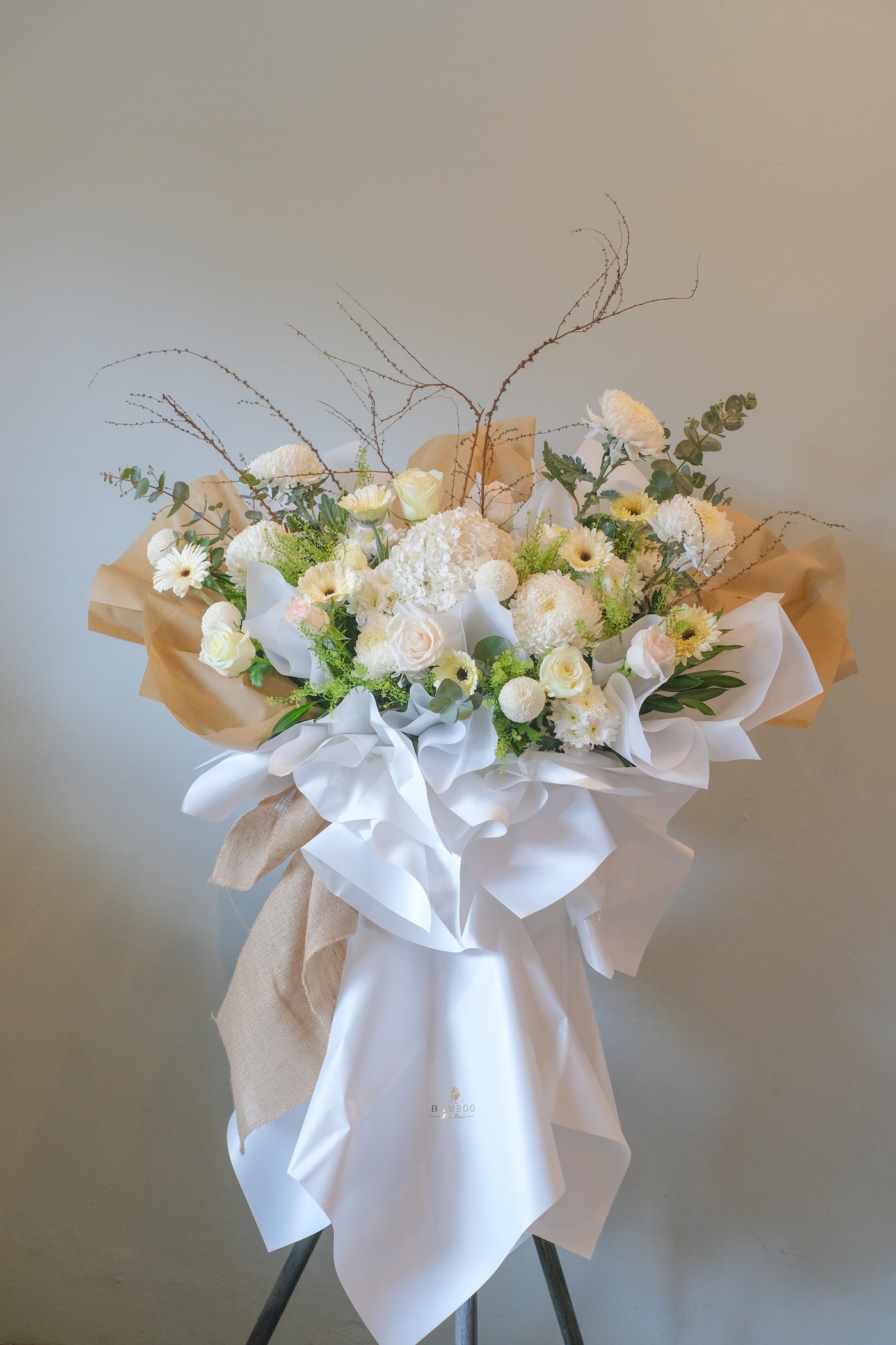 This condolence flowers stand is a beautiful mix of flowers that conveys sweet memories. For same day condolences flowers delivery in Penang.