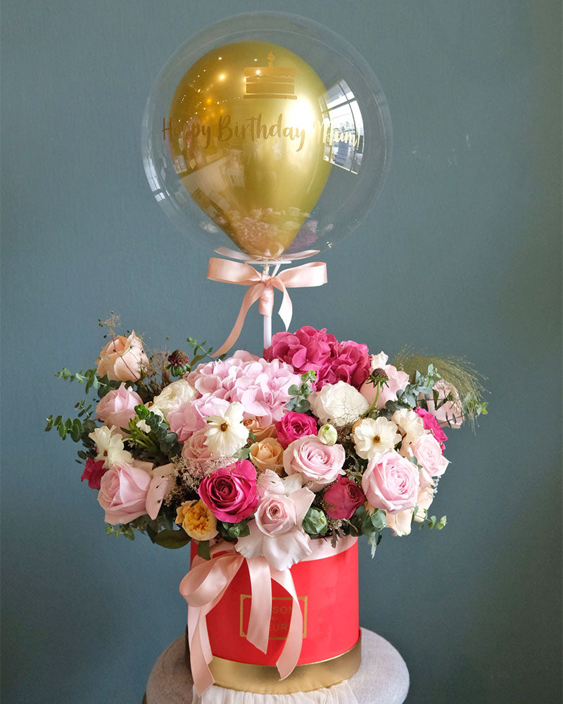 An exclusive bloom box featuring a beautiful assortment of fresh flowers. Order online from Bamboo Green Florist, the top Penang florist with same-day delivery.