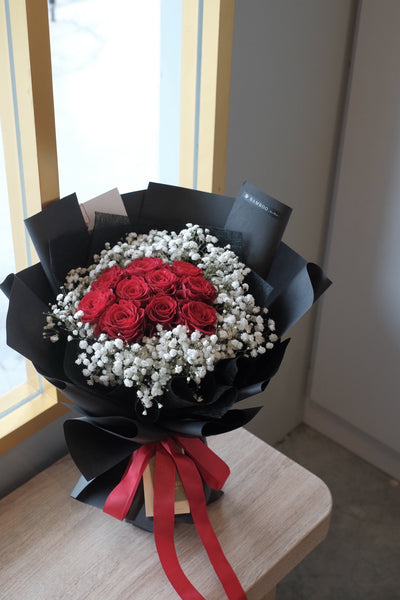 Express your romance with this premium pristine red roses, surrounded with angelic baby breath, in a classical black wrap for valentine's day flowers delivery. Choose your desire stalks.