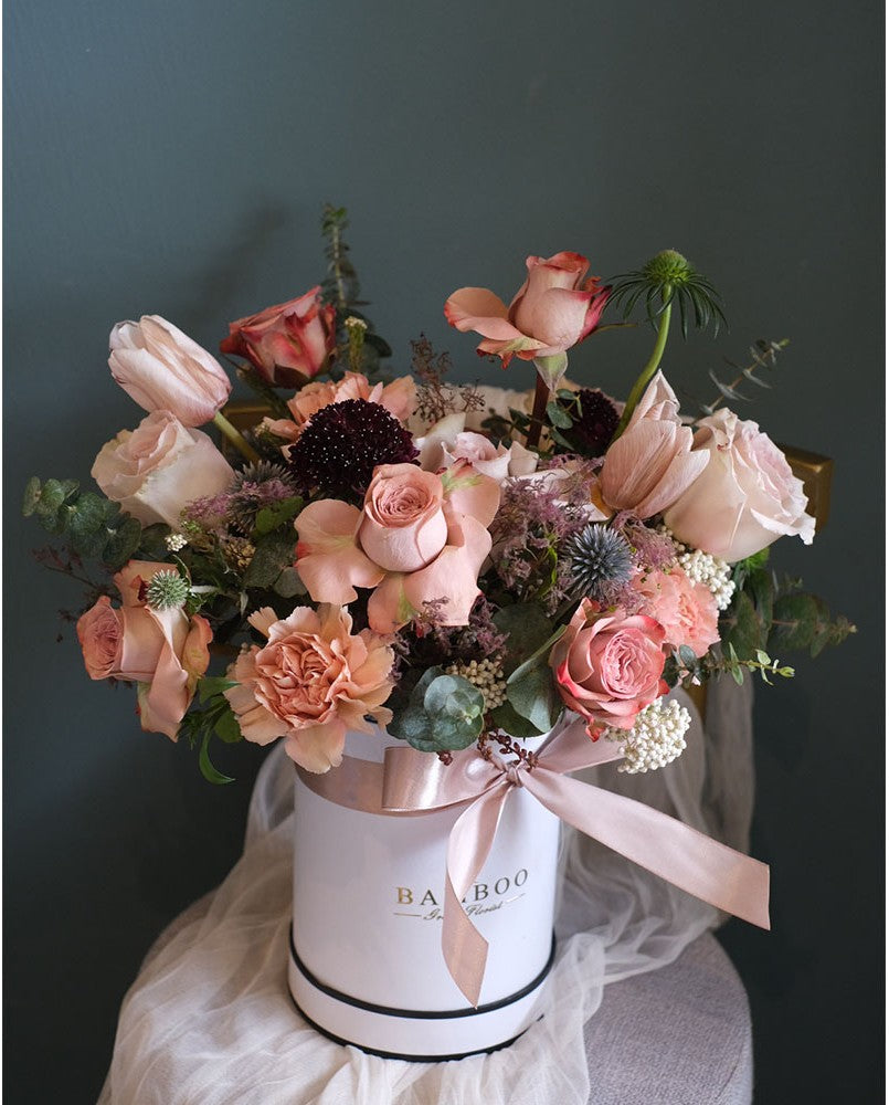 Coffee-toned blooms masterfully arranged in a box, bringing warmth and elegance. Perfect for any space. Same-day flower delivery in Penang by Bamboo Green Florist.