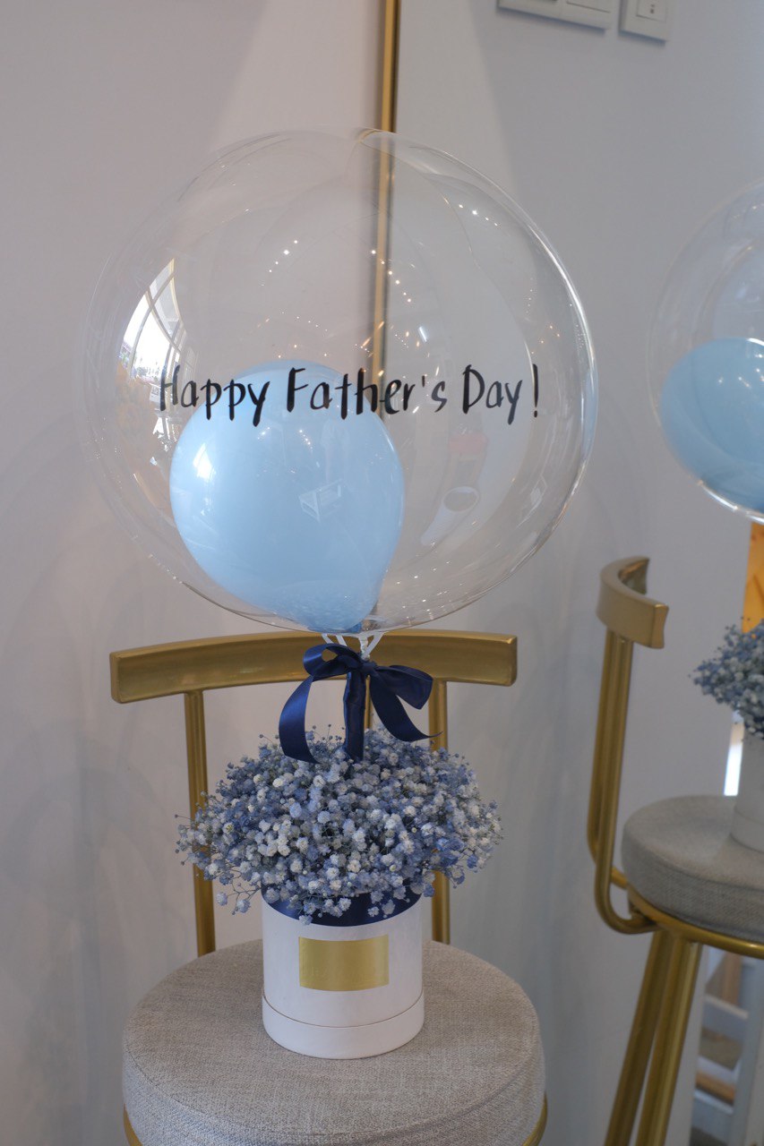 Balloon with baby breath nestled around, a charming gift for any occasion. Order online from Penang florist with same-day delivery available!