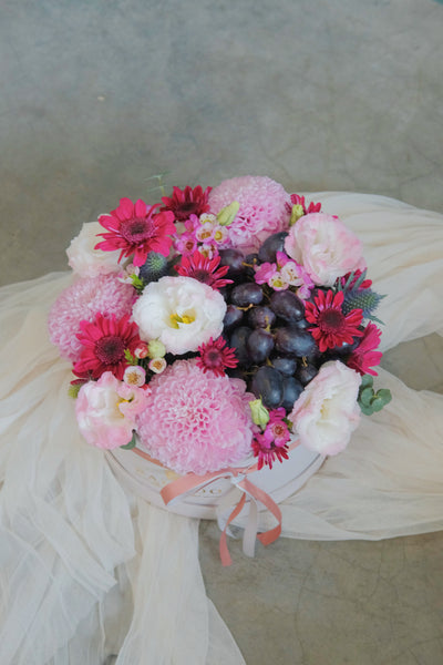 Fruit meets flowers in this delicious arrangement! Brightened by fresh blooms of our choice, this fruit gift basket is a yummy choice packed with tropical and imported fruits. Same day fruit basket delivery in Penang and Butterworth.