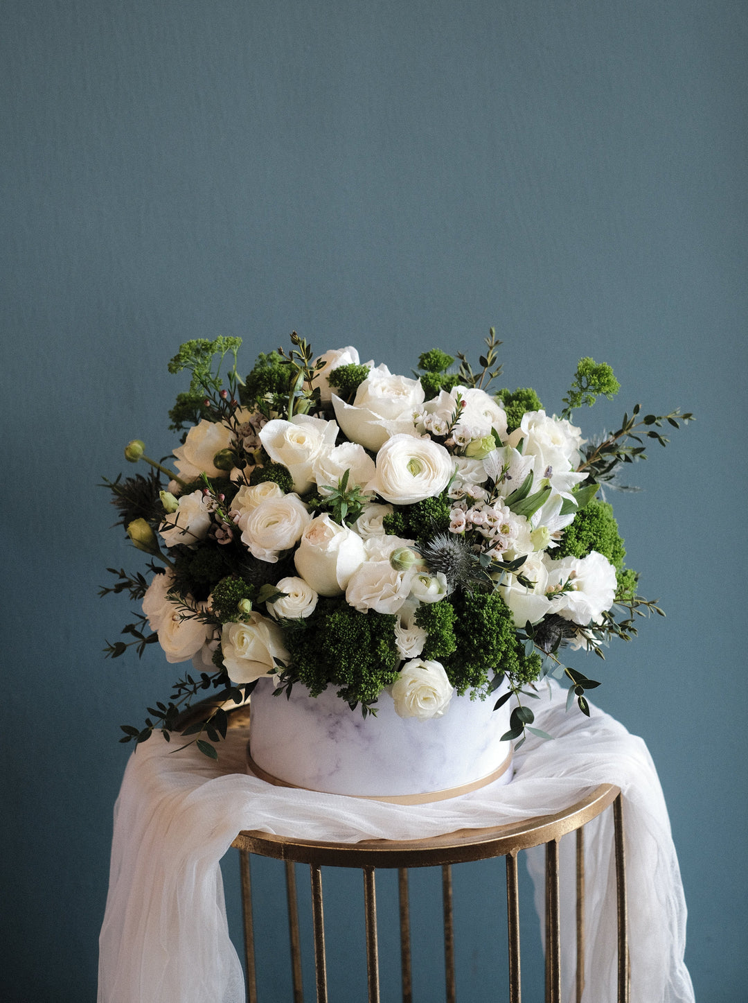 A signature Bloom Box with elegant white blooms. Penang florist with same-day delivery, order online for timeless and sophisticated floral arrangements.