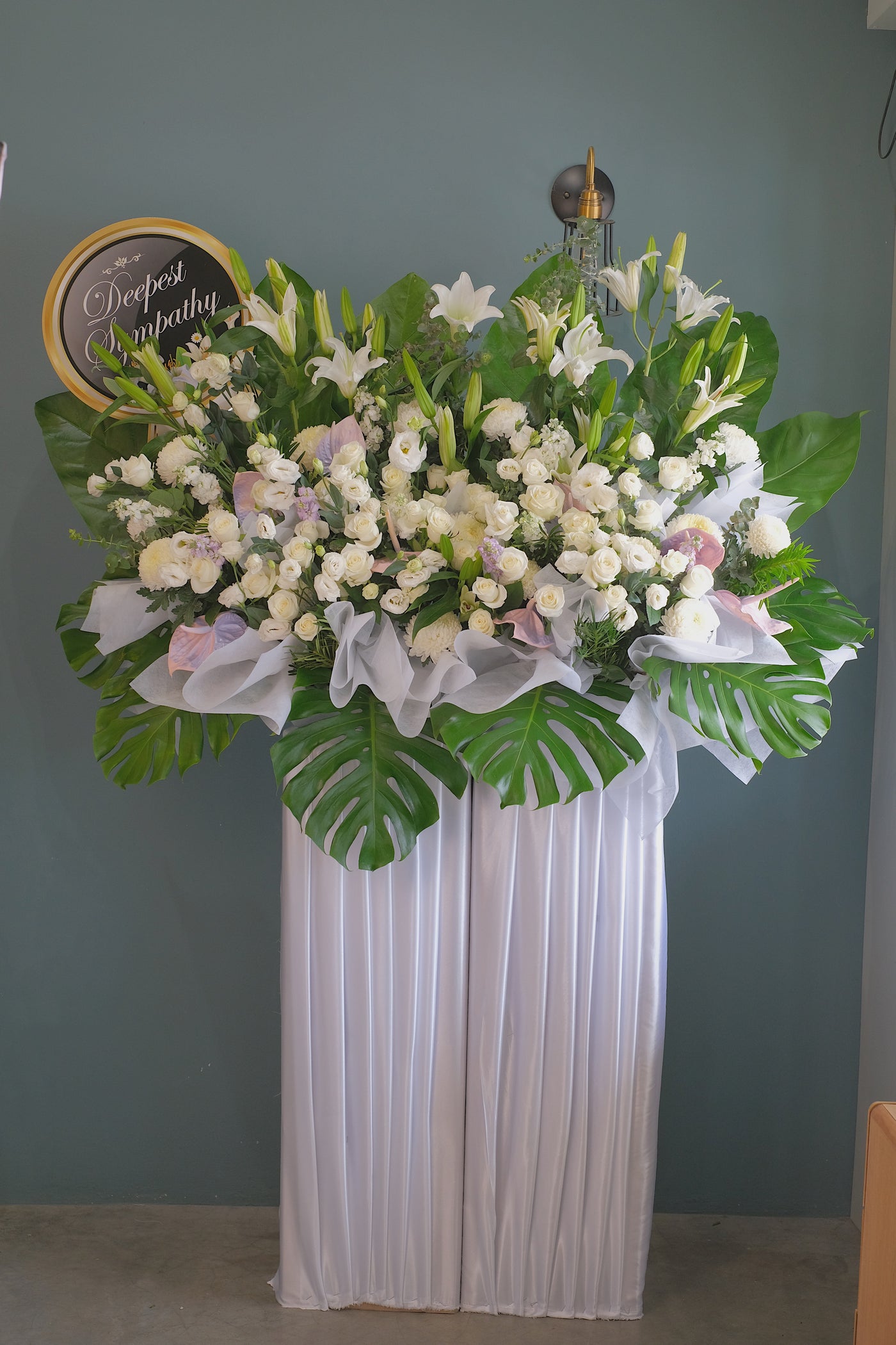Offer your deepest condolences and sympathy with a serene floral tribute of calming colours.  For same day condolences flowers delivery in Penang.