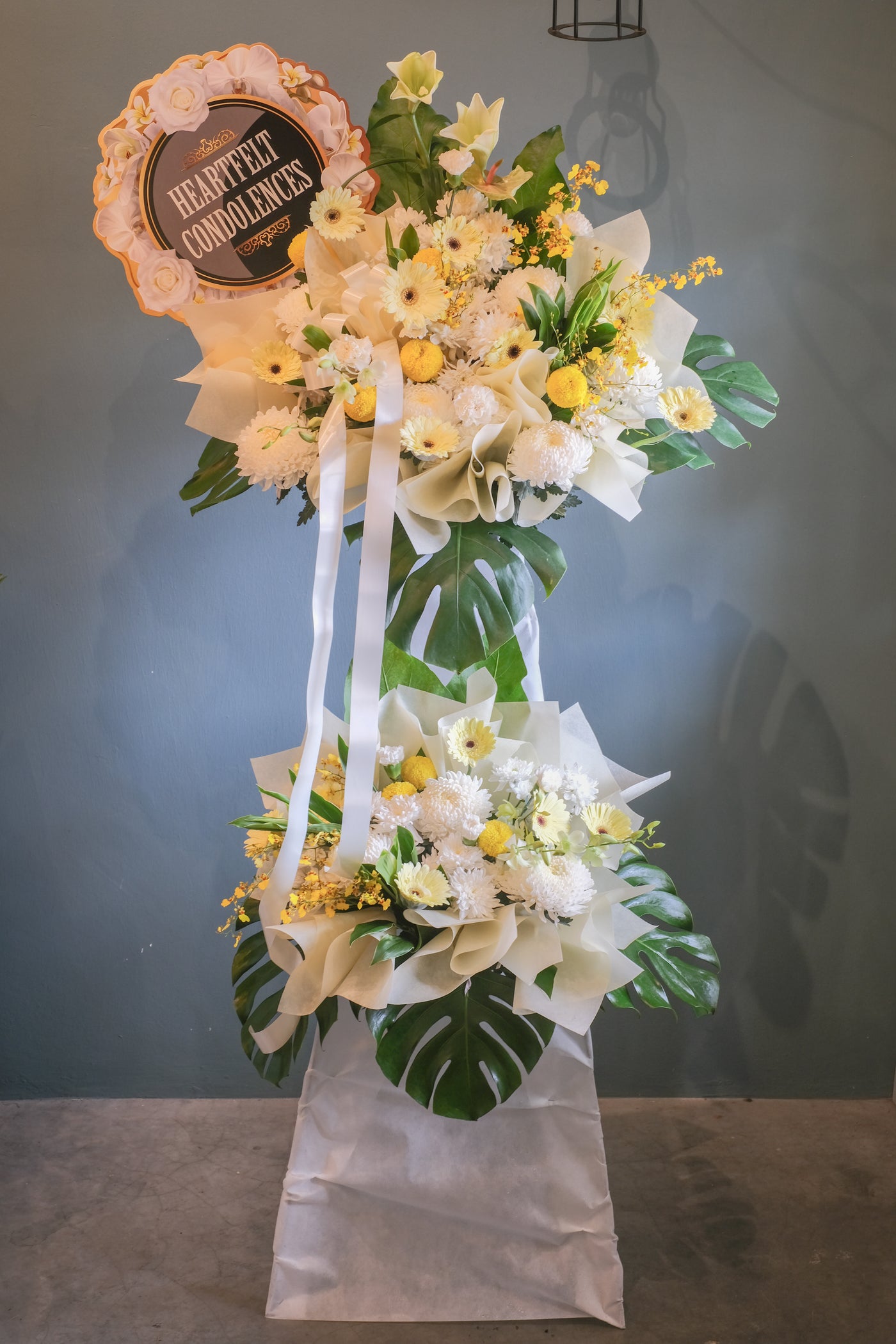 Offer your condolences in a most memorable way and show that you will never forget with this peaceful arrangement. For same day condolences flowers delivery in Penang. 