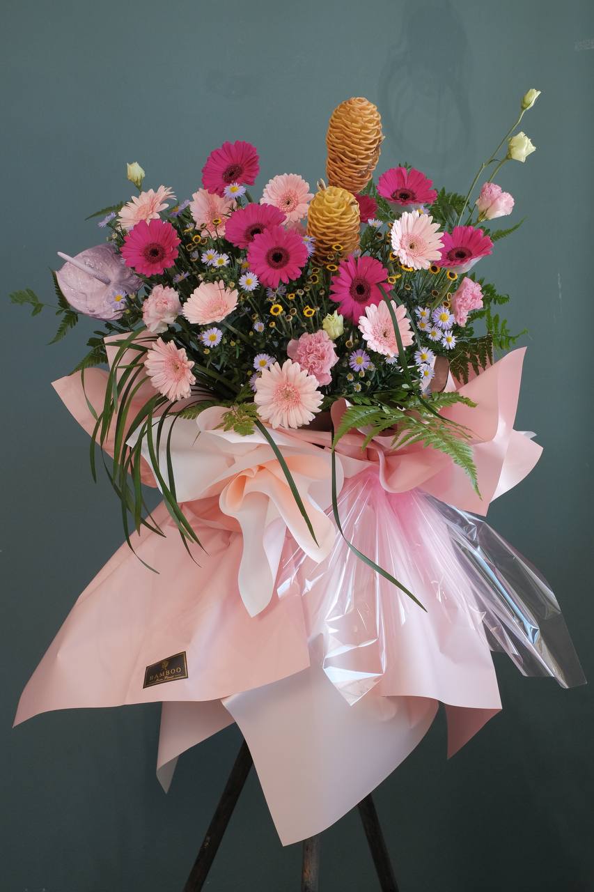 Surprise recipients with a lavish floral stand of abundant pink tone lush flowers. For same day grand opening congratulations flowers delivery in Penang and Butterworth.