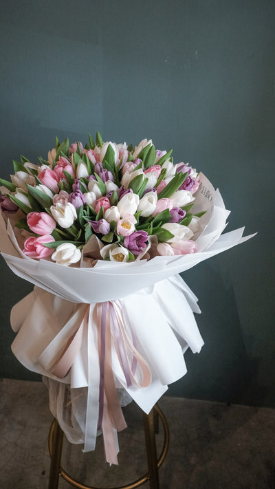 To surprise anyone receives for a smile with this field of assorted colours of tulips.     Photo shown: 100 tulips